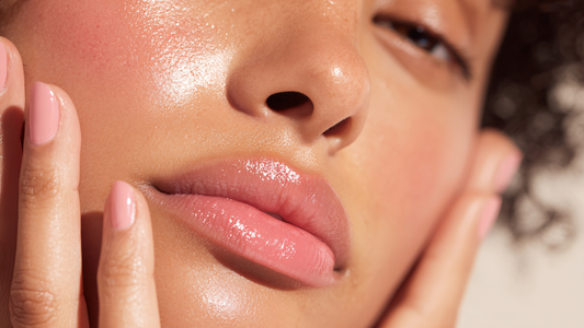 Sunkissed glowy dewy skin close up on face, with hands on cheeks with SUN LOVE hydrating mist